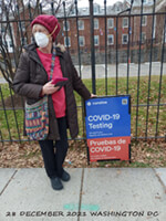 Narda in front of testing site sign in Washington DC
