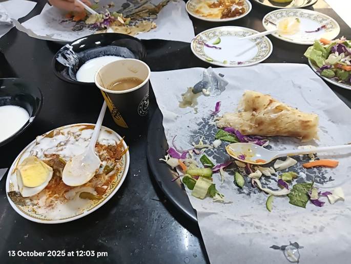 A table with plates and food on it
AI-generated content may be incorrect.