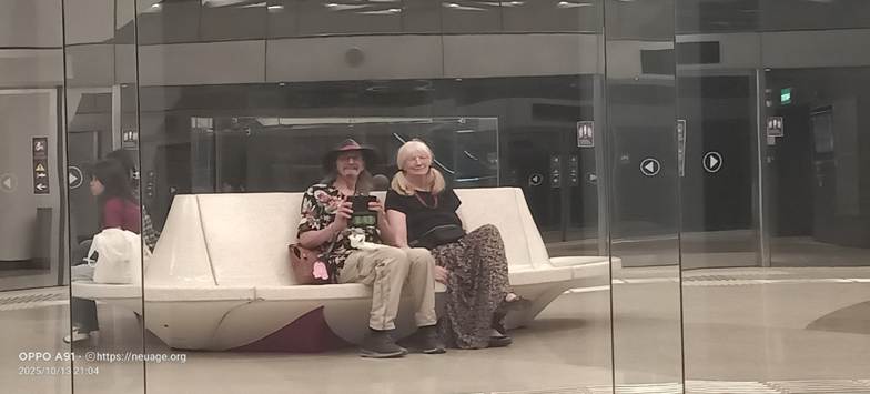 A person and person sitting on a white couch
AI-generated content may be incorrect.